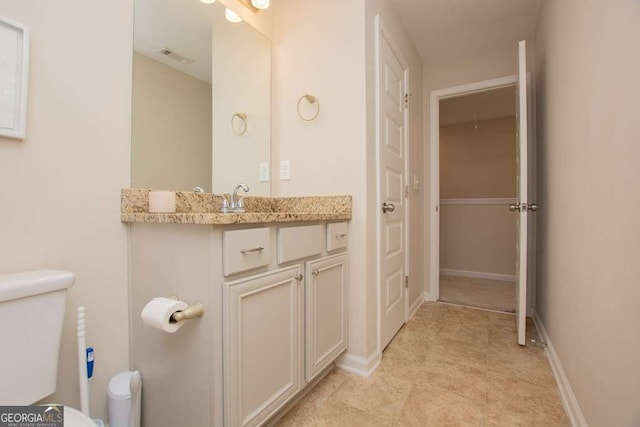 bathroom with vanity and toilet