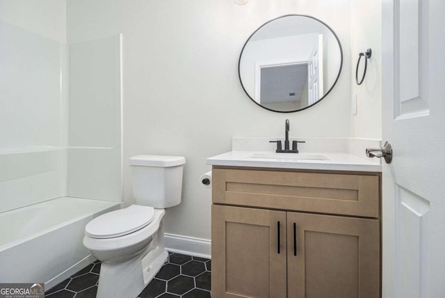 full bathroom with tile patterned floors, vanity, bathtub / shower combination, and toilet