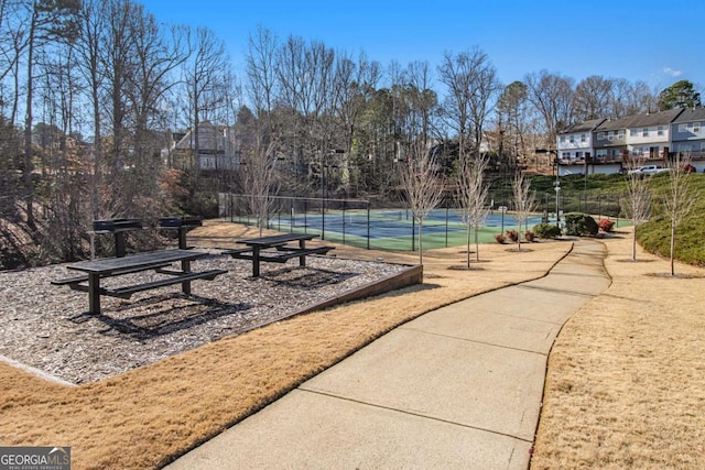 surrounding community featuring tennis court