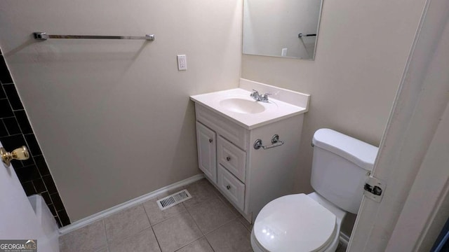 bathroom with tile patterned floors, vanity, and toilet