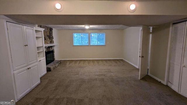 unfurnished living room with light carpet and a fireplace