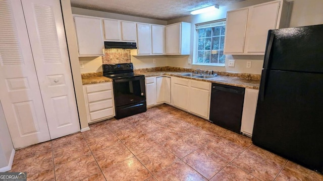 kitchen featuring a textured ceiling, sink, black appliances, white cabinetry, and light tile patterned flooring