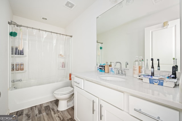 full bathroom featuring wood-type flooring, vanity, toilet, and shower / bathtub combination with curtain