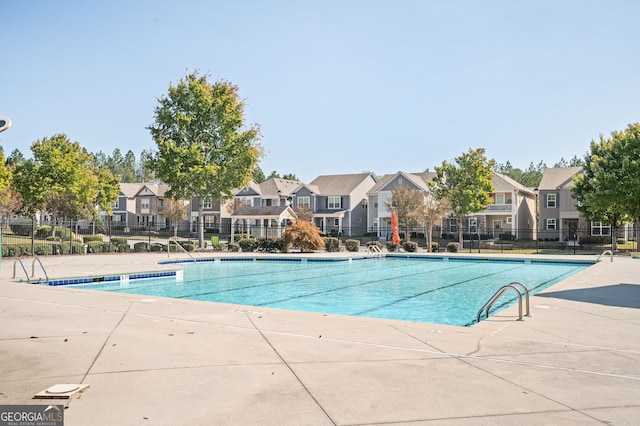 view of swimming pool featuring a patio area