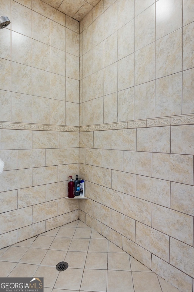 bathroom with a tile shower