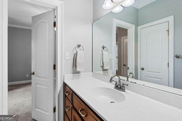 bathroom featuring crown molding and vanity