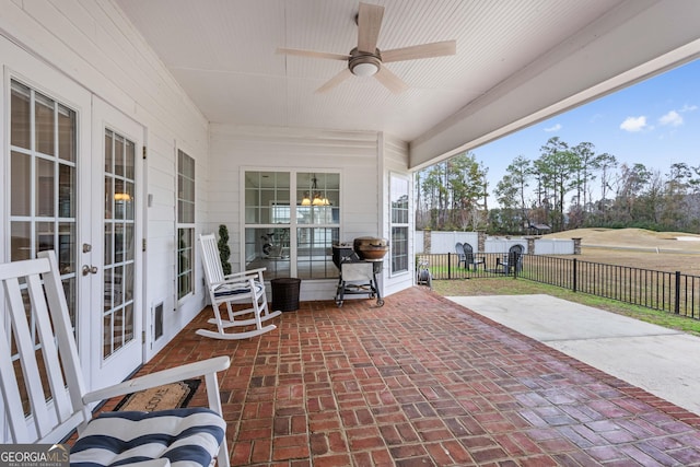 view of patio featuring ceiling fan and french doors