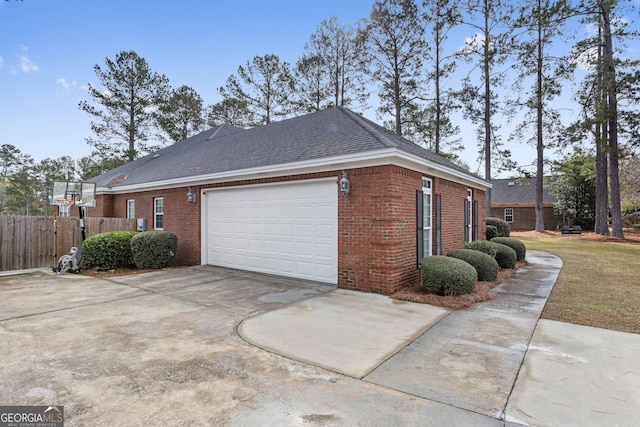 view of side of home featuring a garage