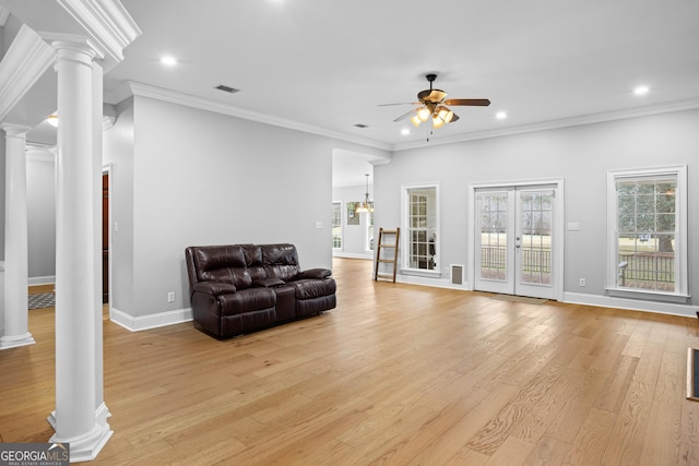 living room with light hardwood / wood-style flooring, ornate columns, ceiling fan, and ornamental molding