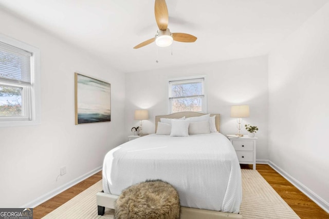 bedroom featuring ceiling fan and hardwood / wood-style flooring