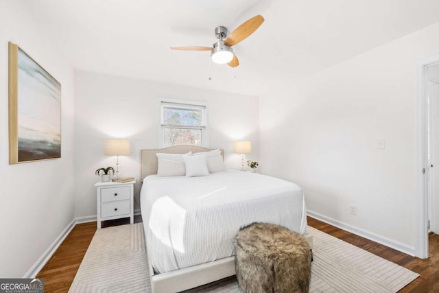 bedroom featuring ceiling fan and dark hardwood / wood-style floors