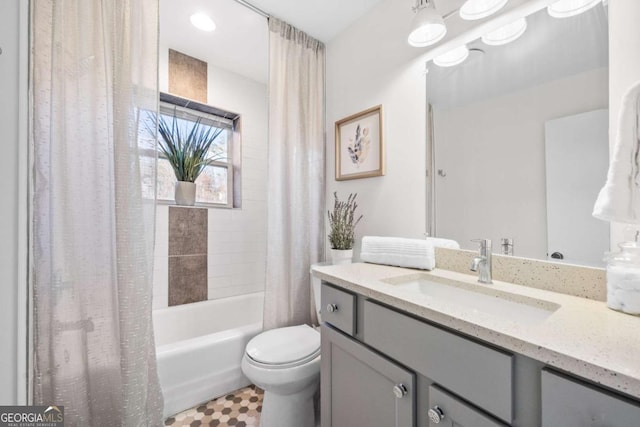 full bathroom featuring vanity, shower / tub combo, and toilet