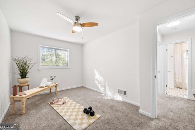 interior space featuring ceiling fan