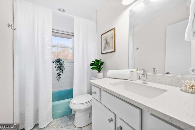 full bathroom featuring vanity, toilet, and shower / tub combo