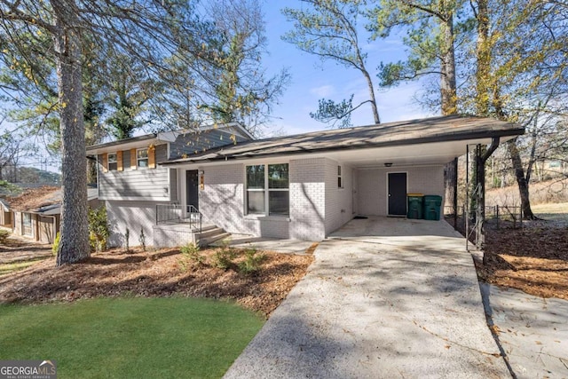 view of front of home with a carport