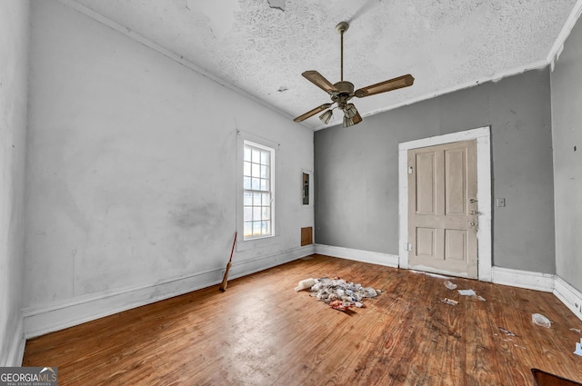 spare room featuring ceiling fan, a textured ceiling, and hardwood / wood-style flooring