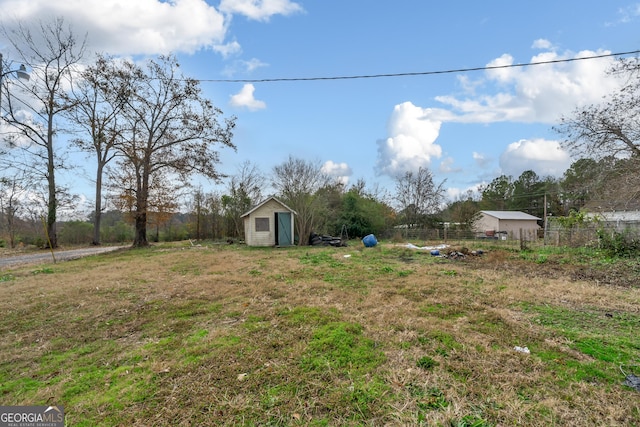 view of yard with a storage unit