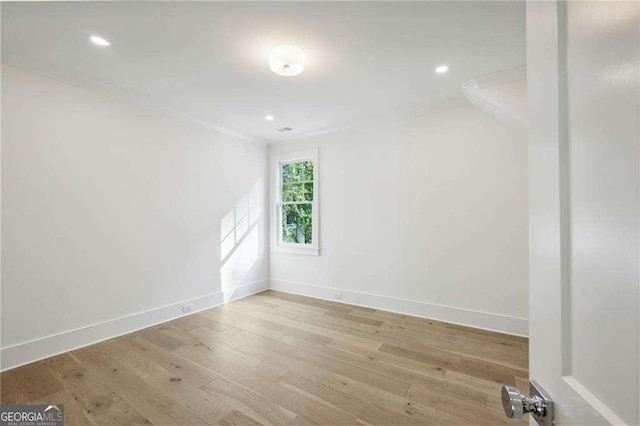 spare room featuring light hardwood / wood-style floors