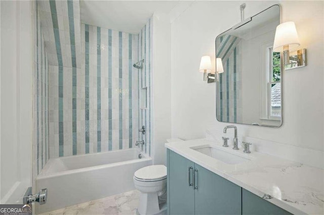 full bathroom with vanity, toilet, and tiled shower / bath