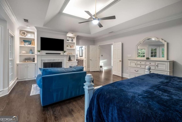 bedroom with ornamental molding, a raised ceiling, ceiling fan, and dark wood-type flooring