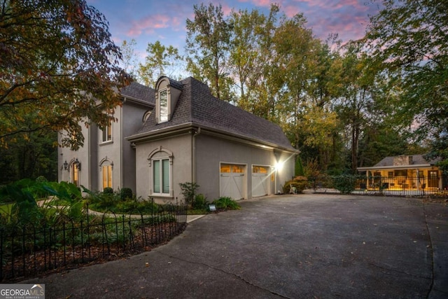 view of property exterior at dusk