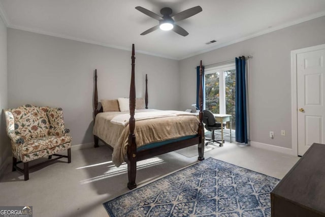 carpeted bedroom with ceiling fan and ornamental molding