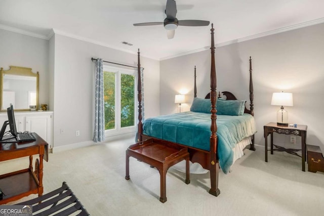 carpeted bedroom with ceiling fan and crown molding