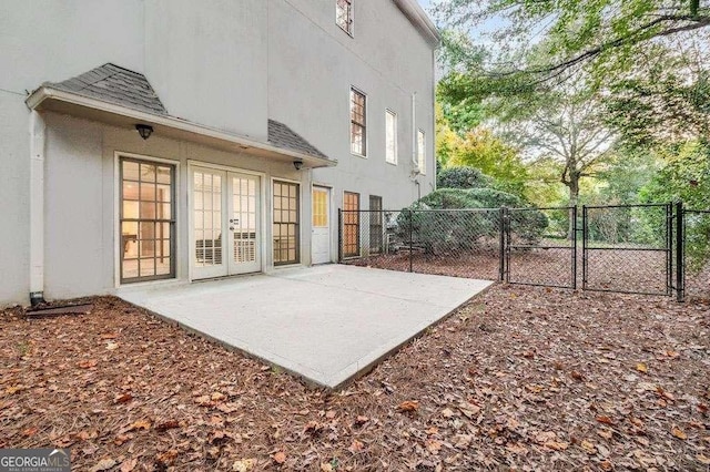 back of house with french doors and a patio