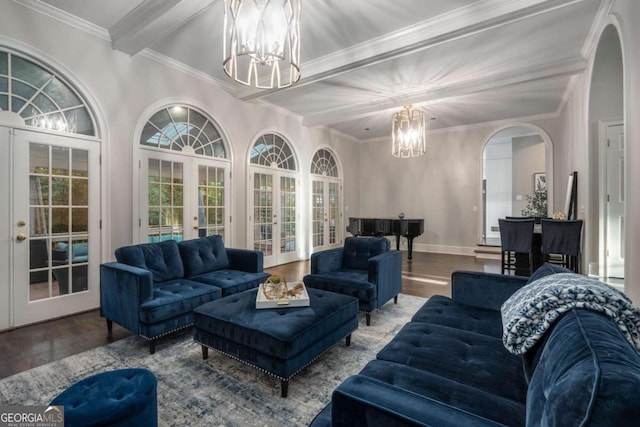 living room featuring french doors, crown molding, a notable chandelier, beamed ceiling, and hardwood / wood-style floors