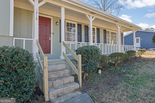 doorway to property with a porch