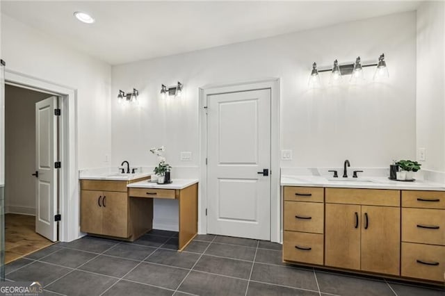 bathroom featuring tile patterned flooring and vanity