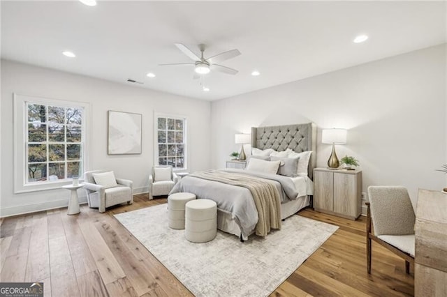 bedroom featuring ceiling fan and light wood-type flooring