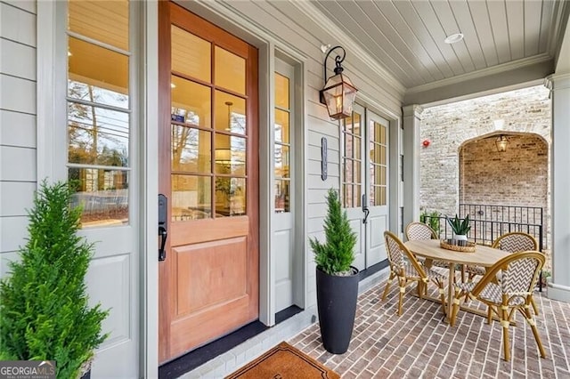 doorway to property with covered porch