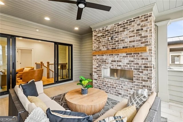 view of patio featuring an outdoor living space with a fireplace and ceiling fan