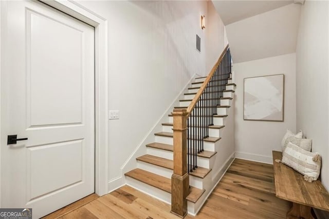 stairway with wood-type flooring