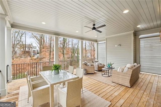 sunroom featuring ceiling fan