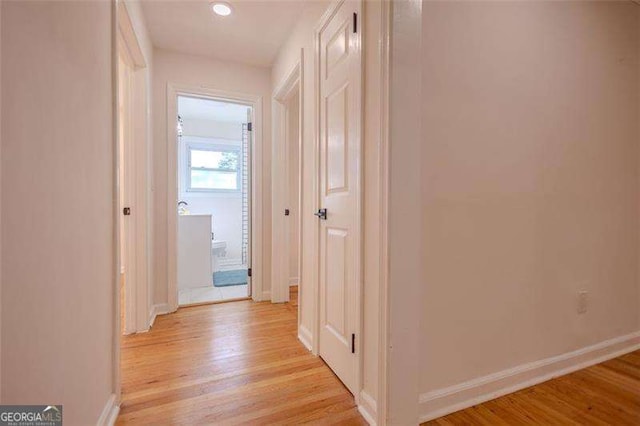 corridor featuring light wood-type flooring