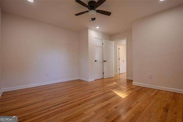 empty room featuring light hardwood / wood-style flooring and ceiling fan