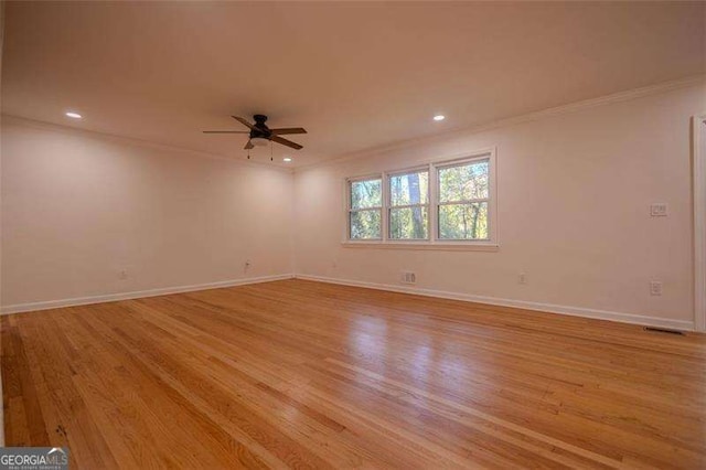 unfurnished room featuring ceiling fan and light wood-type flooring