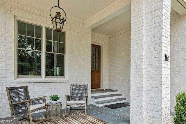 entrance to property featuring covered porch