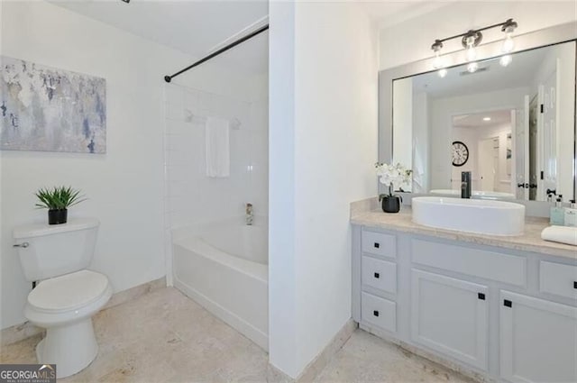 full bathroom with washtub / shower combination, vanity, and toilet