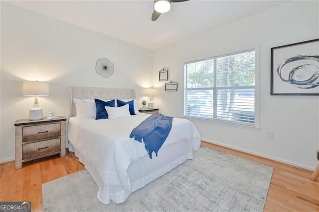 bedroom featuring ceiling fan and wood-type flooring