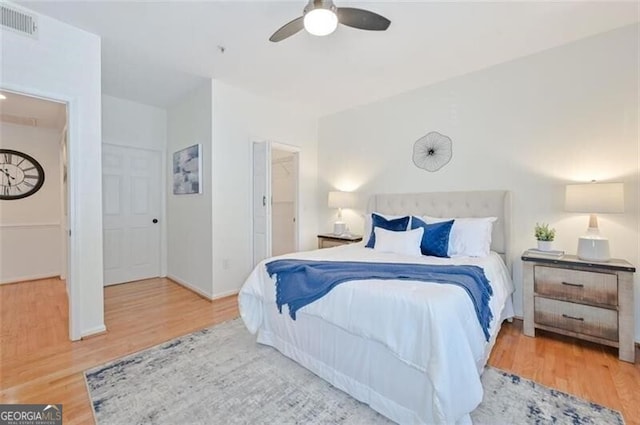 bedroom featuring wood-type flooring and ceiling fan