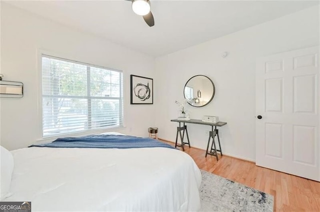 bedroom featuring wood-type flooring and ceiling fan