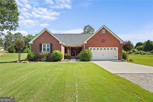 view of front of property featuring a garage and a front lawn