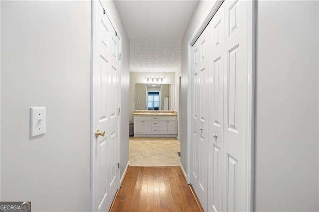 corridor featuring light hardwood / wood-style floors