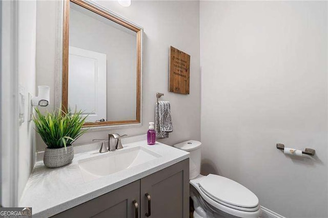 bathroom with vanity and toilet