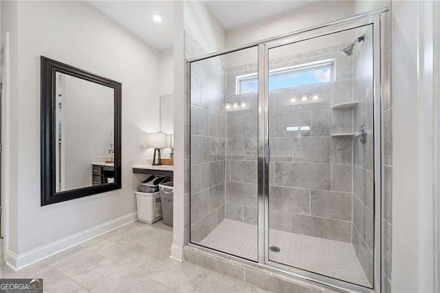 bathroom featuring a shower with door