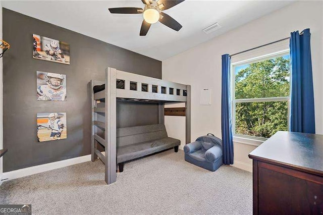 bedroom featuring light carpet and ceiling fan