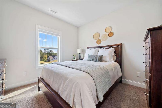 bedroom featuring dark carpet